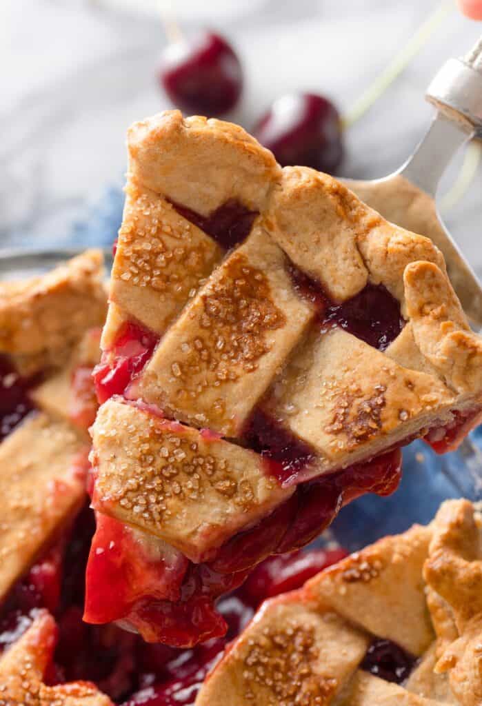 a slice of Gluten Free Cherry Pie held up on a spatula