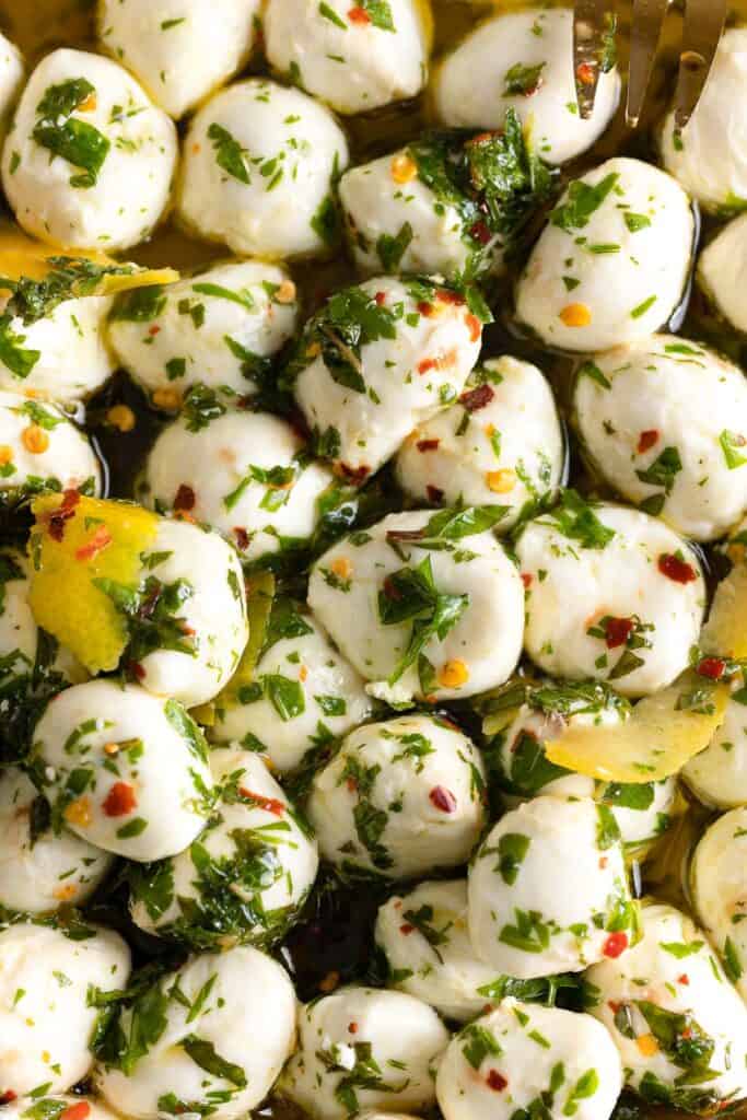 Marinated Mozzarella balls covered in a Lemon Chili Herb marinade