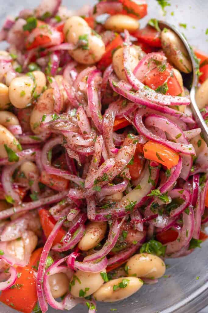 sumac onions mixed with chopped tomatoes and butter beans