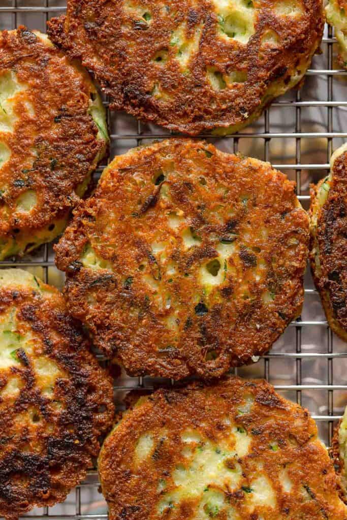 Ricotta Zucchini Fritters cooling on a wire rack