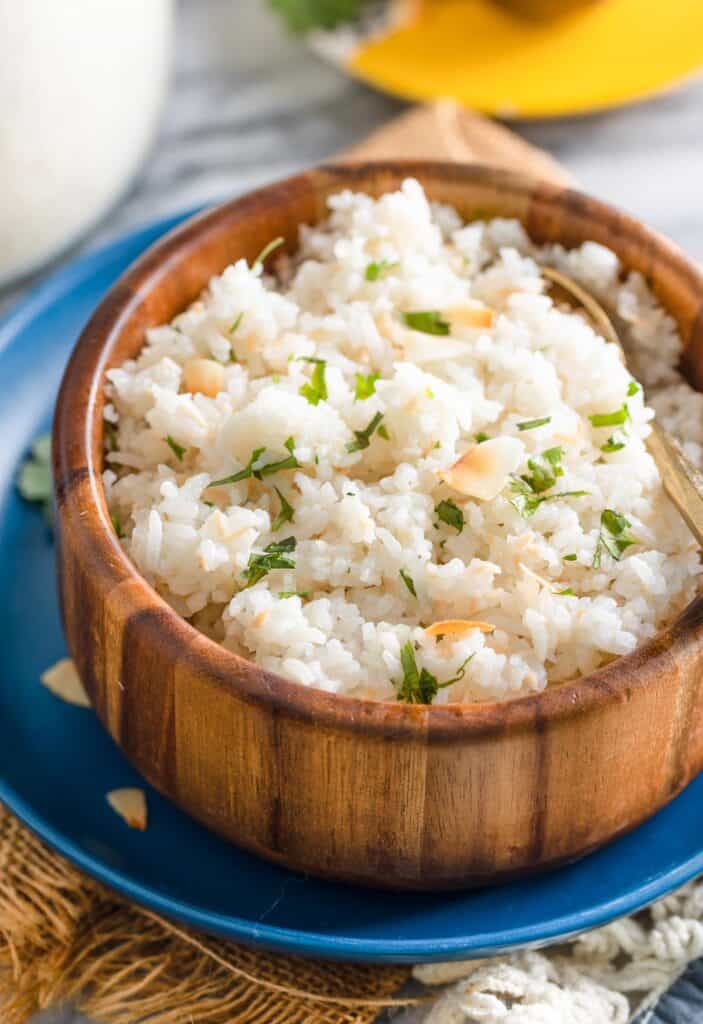 Toasted Coconut Rice in a bowl with fresh cilantro mixed in