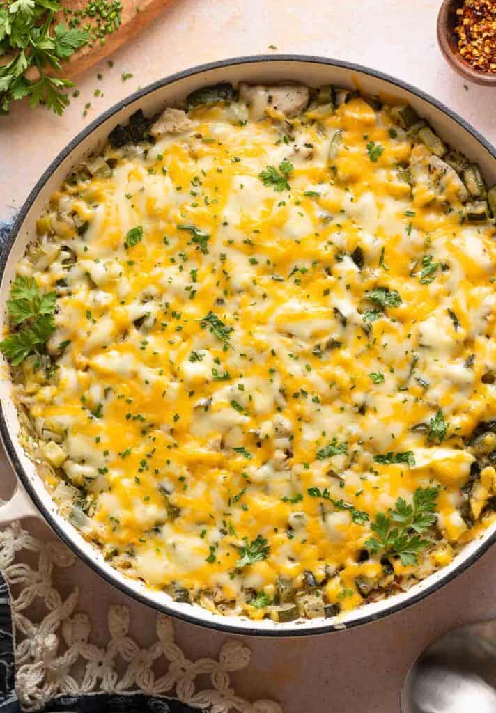 One Pot Cheesy Zucchini Chicken & Rice topped with fresh parsley