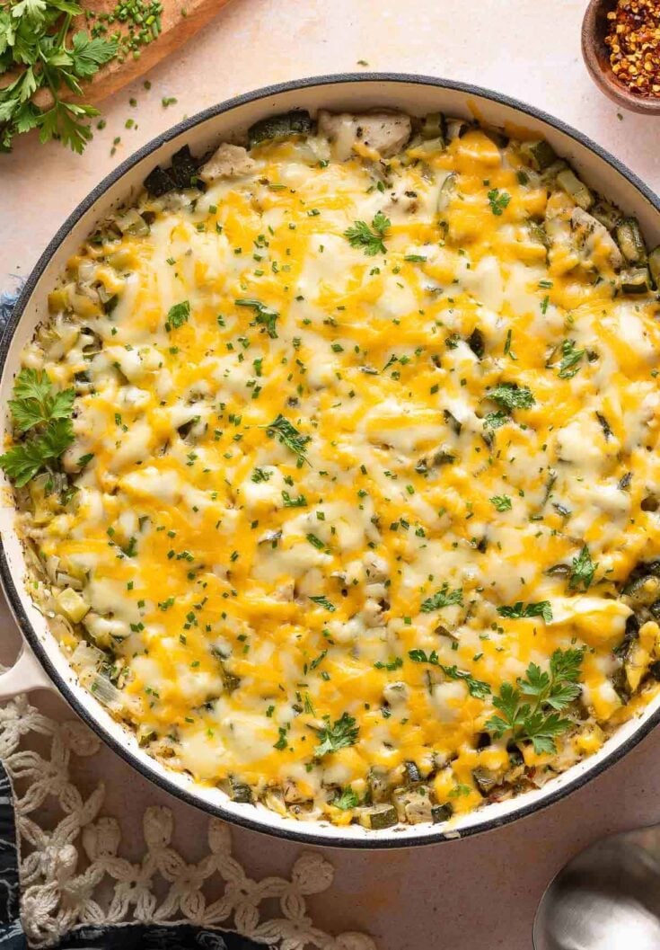 Cheesy Zucchini Chicken & Rice topped with fresh chopped chives and parsley