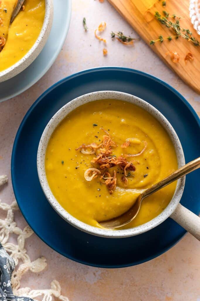 Roasted Acorn Squash Soup topped with frying shallots