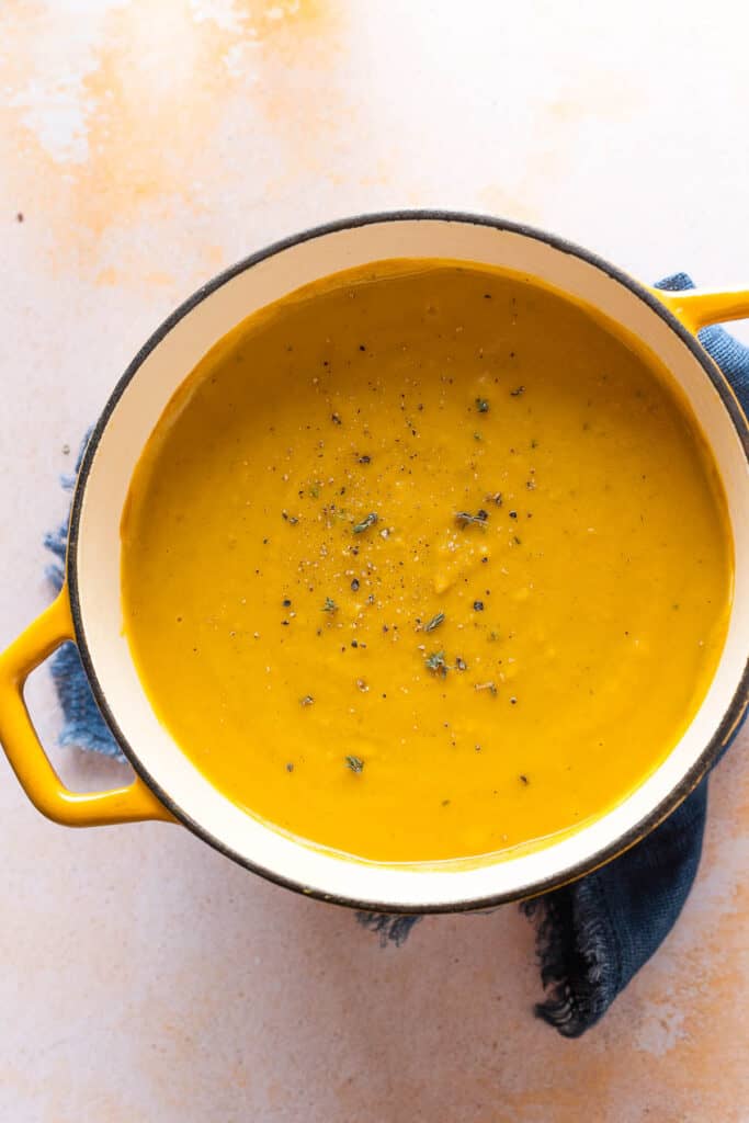 a big pot of Roasted Acorn Squash Soup with fresh thyme