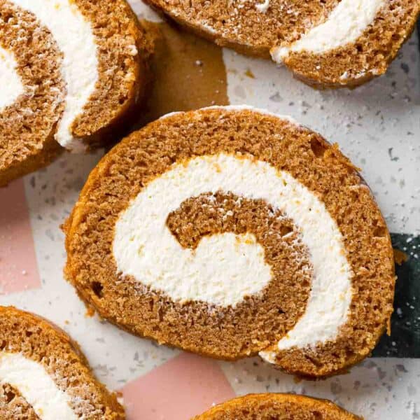 slices of Gluten Free Pumpkin Roll & Whipped Cream Cheese Frosting on a serving platter