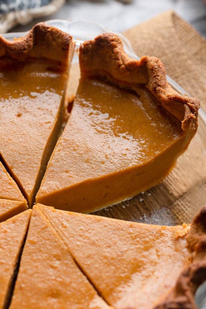 gluten free sweet potato pie slices in a pie dish