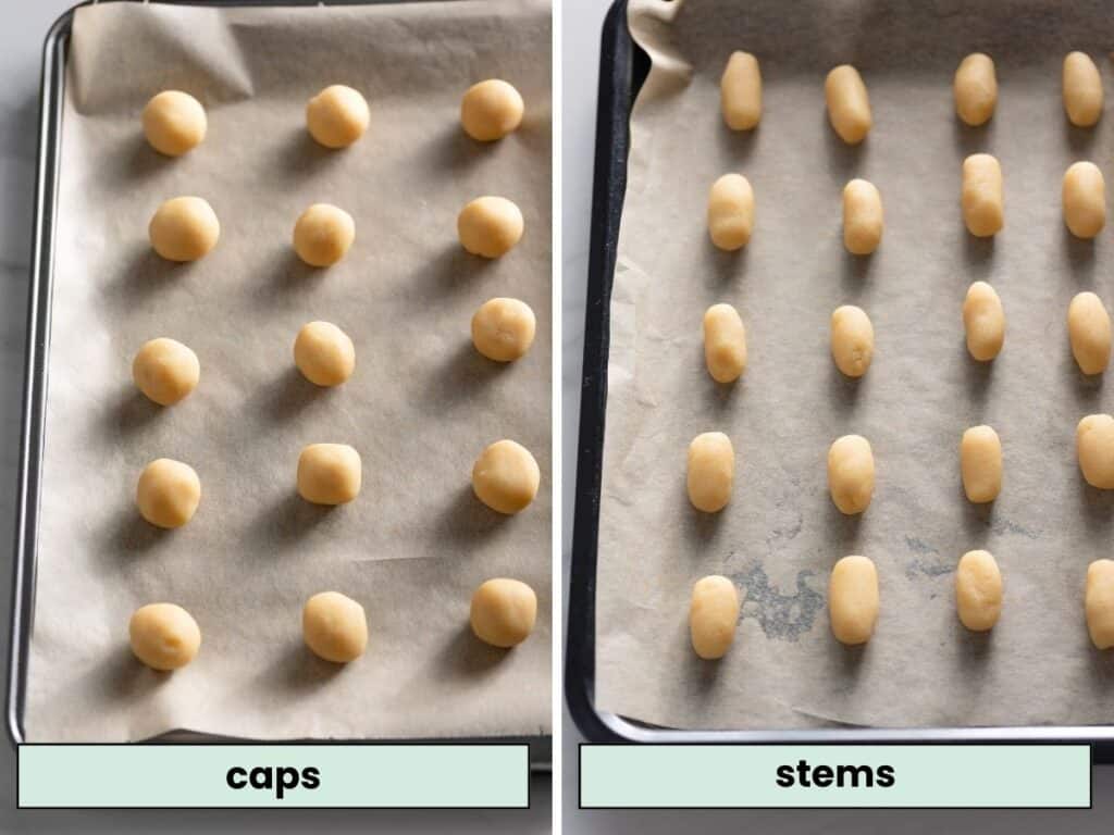 sugar cookie dough shaped into mushroom stems and caps on a baking sheet