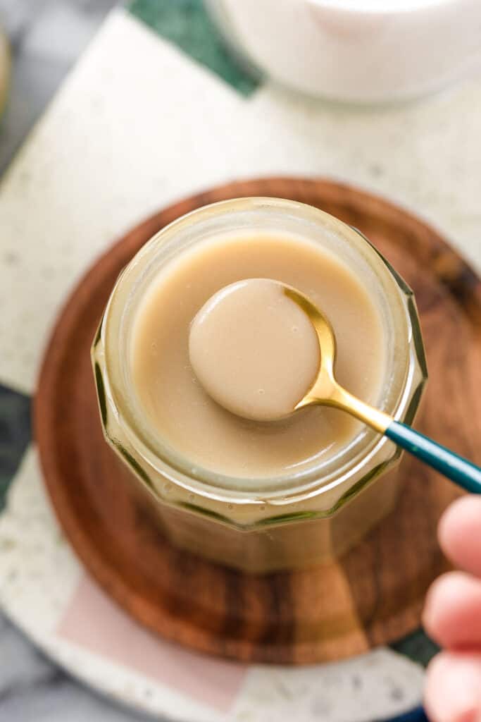 a small spoonful of a spoon of condensed milk made from coconut milk