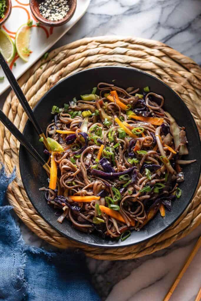 a serving bowl full o Carrot and Cabbage Noodle Stir Fry