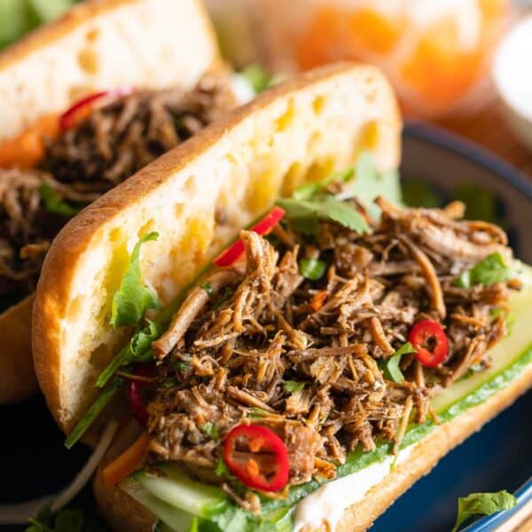 Vietnamese Five Spice Pulled Pork in a bahn mi sandwich