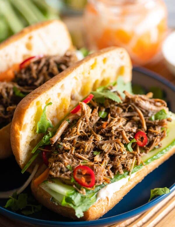 Vietnamese Five Spice Pulled Pork in a bahn mi sandwich