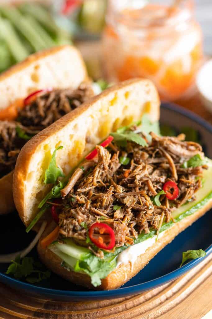 Vietnamese Five Spice Pulled Pork in a bahn mi sandwich