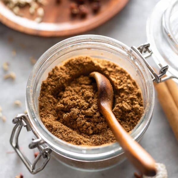 a small storage jar full of homemade Chinese five spice powder