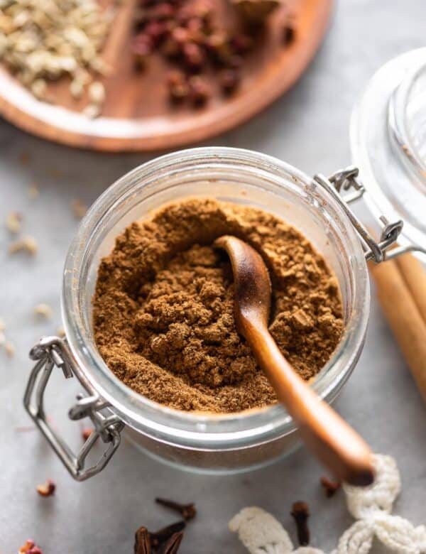 a small storage jar full of homemade Chinese five spice powder