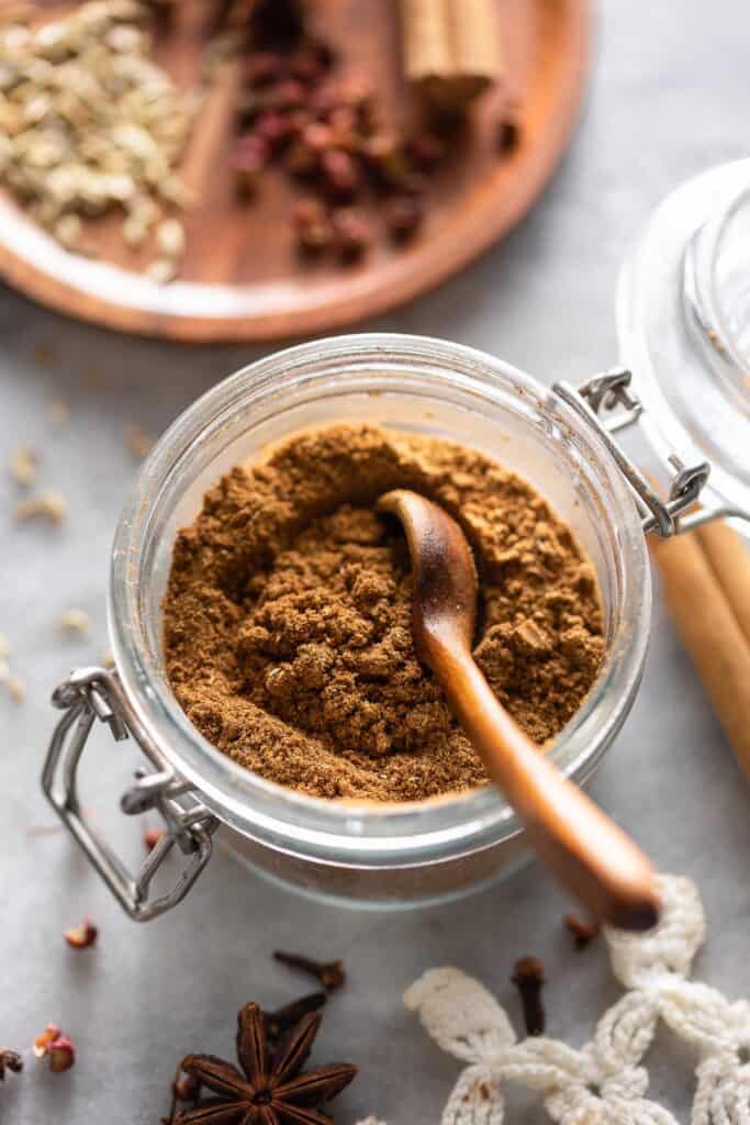 a small storage jar full of homemade Chinese five spice powder