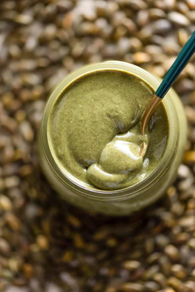 Homemade Pumpkin Seed Butter in a jar with a spoon