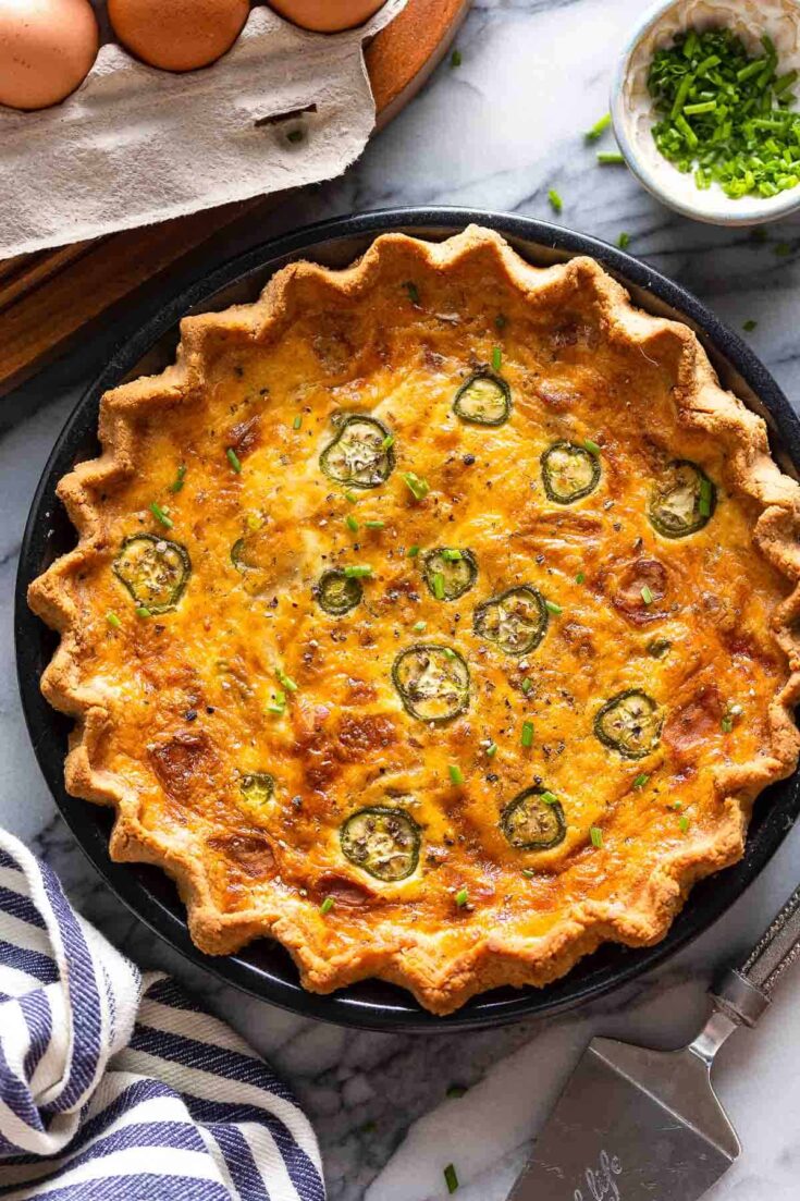 Bacon & Cheddar Jalapeño Quiche with fresh chives on top