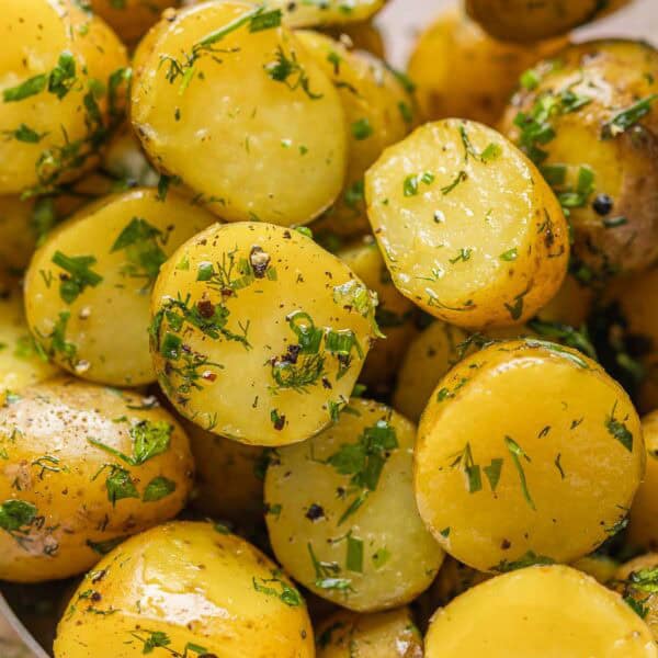 Herby Boiled Potatoes coated in black pepper, chopped fresh herbs and olive oil