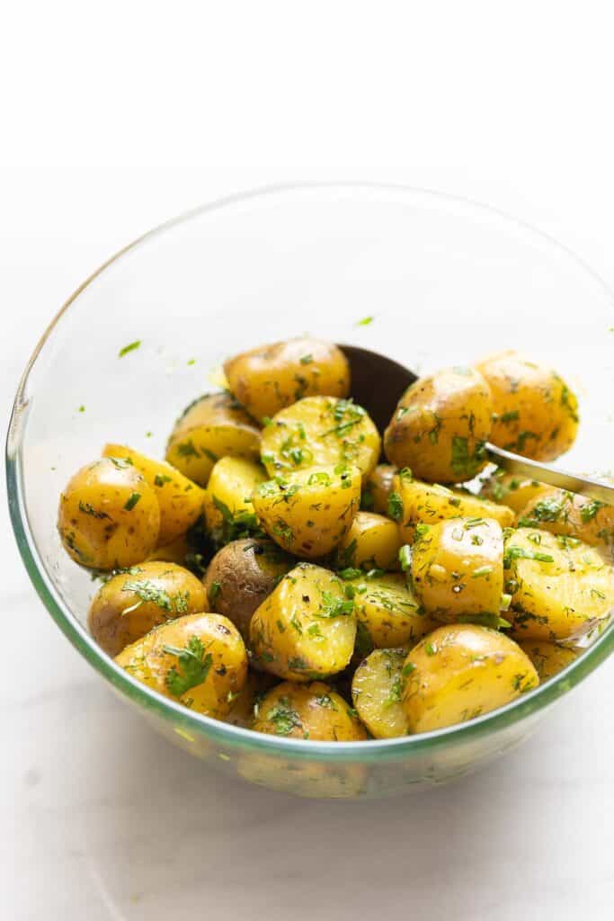 herby boiled potatoes in a mixing bowl