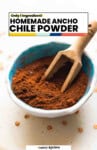 Homemade Ancho Chile pinterest marketing image: only 1 ingredient! Homemade spice in a small bowl with a wooden scoop.