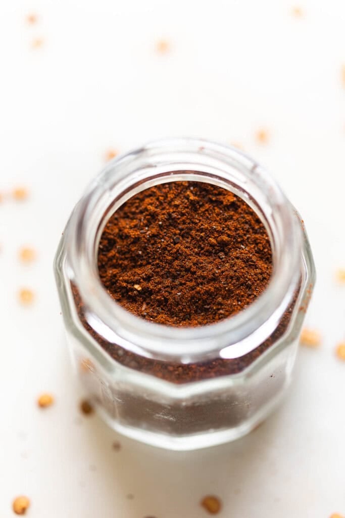 Homemade Ancho Chili Powder in a spice jar