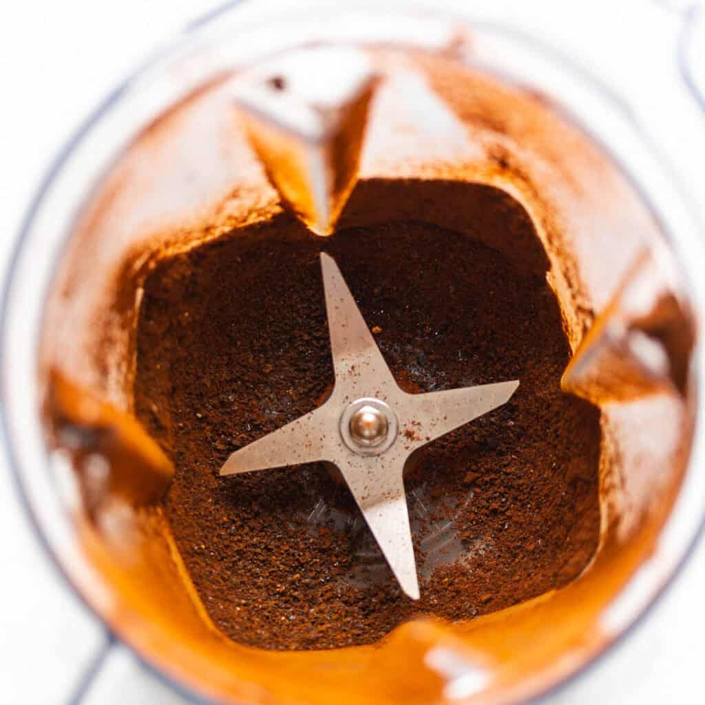 Finely ground up ancho chile powder in a blender.