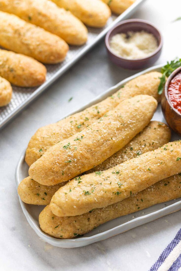 Gluten free breadsticks on a platter.