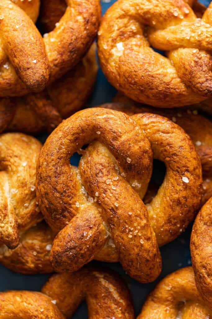 Homemade gluten free soft pretzels in a pile.