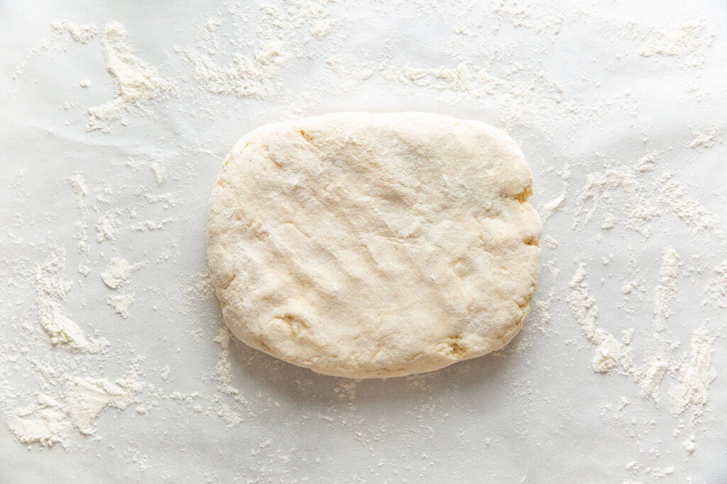 Gluten free cinnamon dough covered with flour.