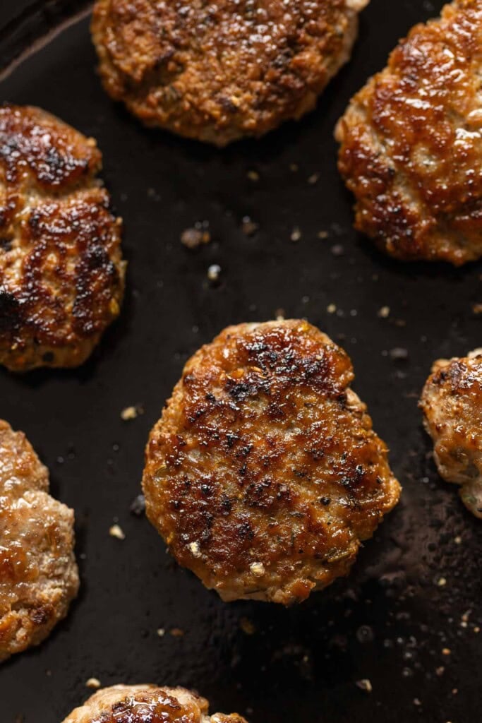 Turkey Maple Breakfast Sausage Patties on a cast iron skillet.