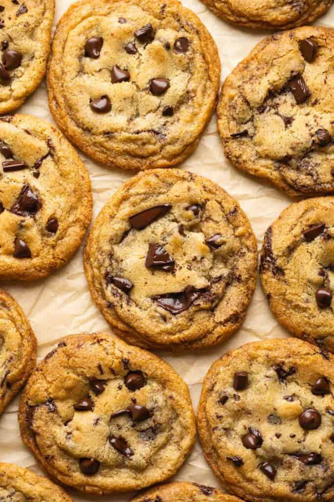Gluten Free Brown Butter Chocolate Chip Cookies on a piece of baking paper