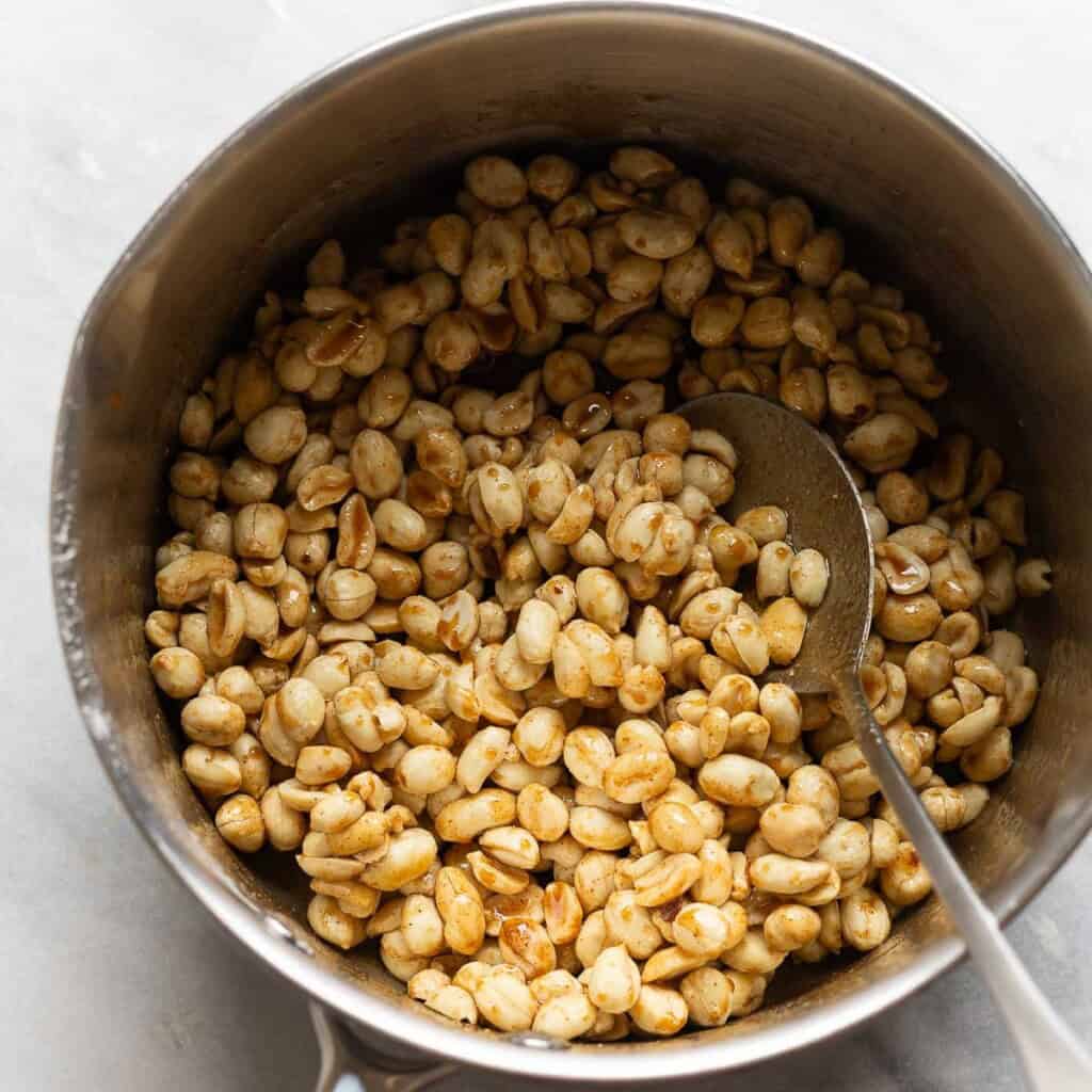Lightly roasted peanuts mixed into a sticky mixture made from: Sugar, honey, butter, starch and spices
