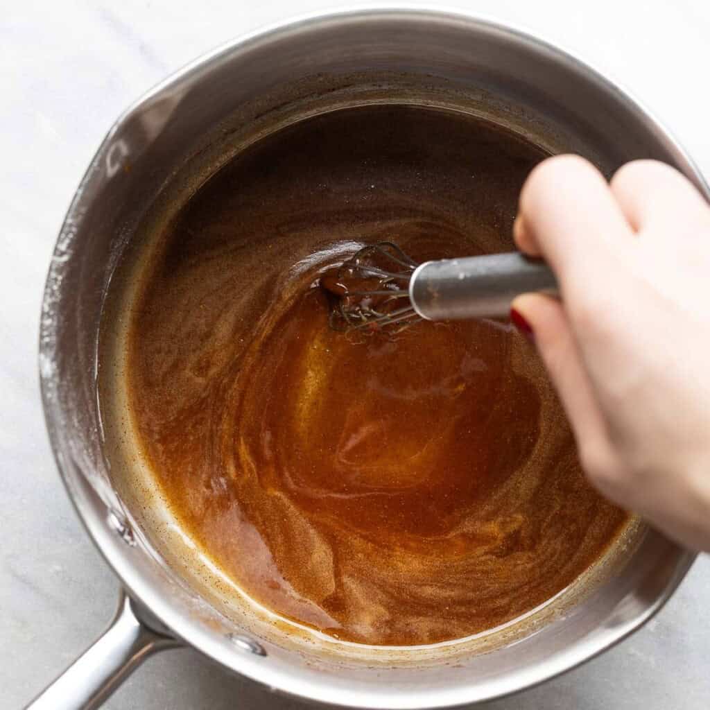 Sugar, honey, butter, starch and spices melted and whisked together in a sauce pan.