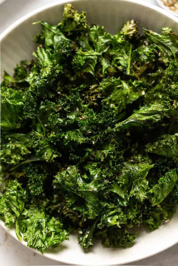 Homemade baked kale chips in a serving bowl seasoned with za'atar spice