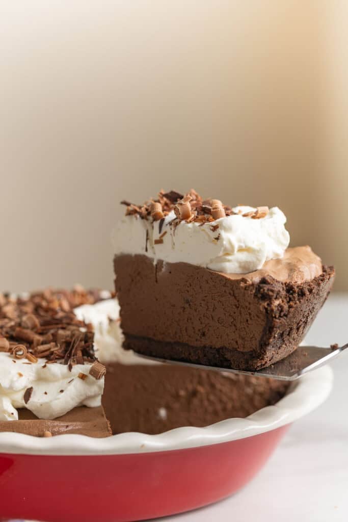 a slice of gluten free french silk pie held up on a spatula