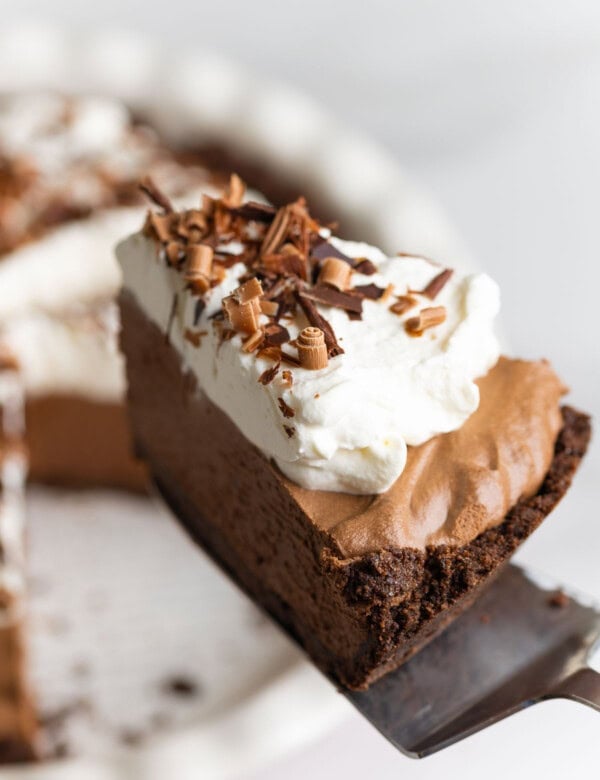 a slice of gluten free french silk pie held up on a spatula