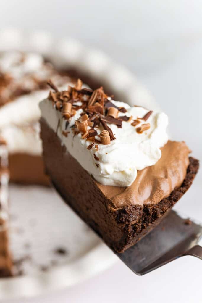 a slice of gluten free french silk pie held up on a spatula