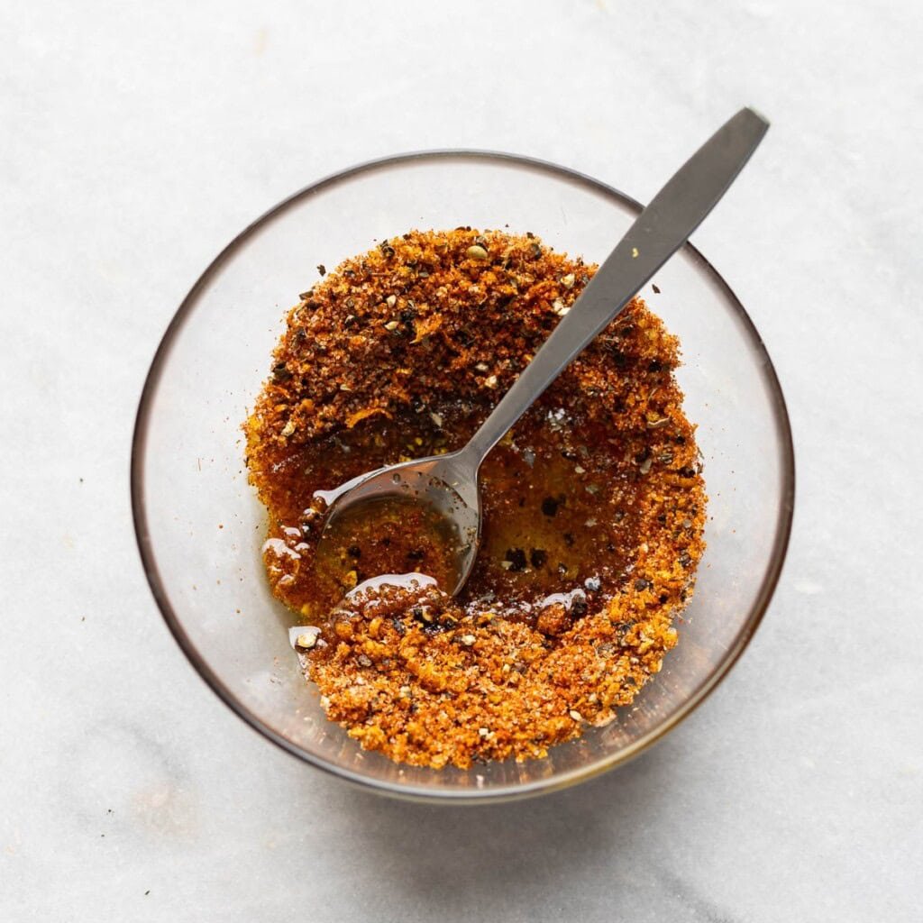 A small bowl of mixed spices with oil