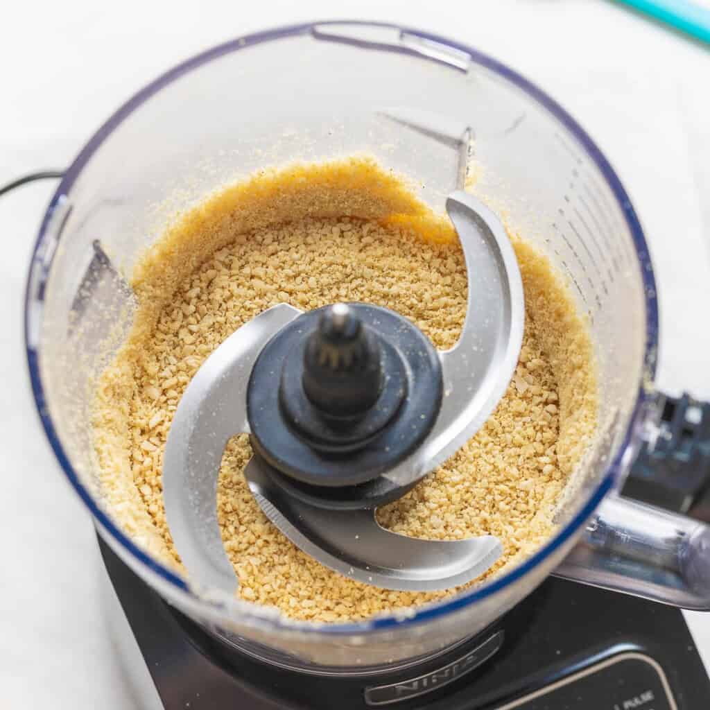 Vegan parmesan made from blended nuts, onion & garlic powder, salt and nutritional yeast in a food processor.
