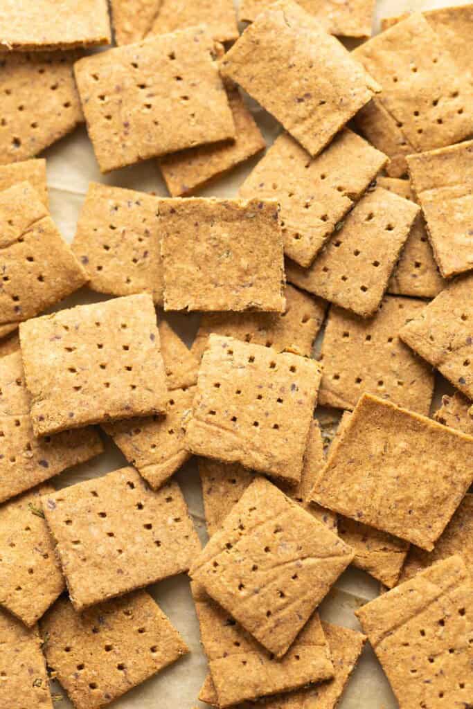 Almond pulp crackers piled on baking paper