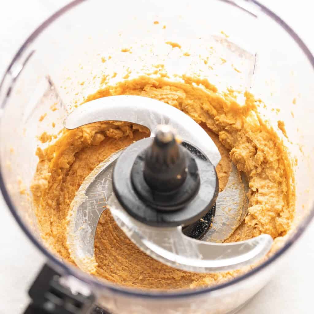 Tahini blended in a food processor with garlic, lemon juice and spices