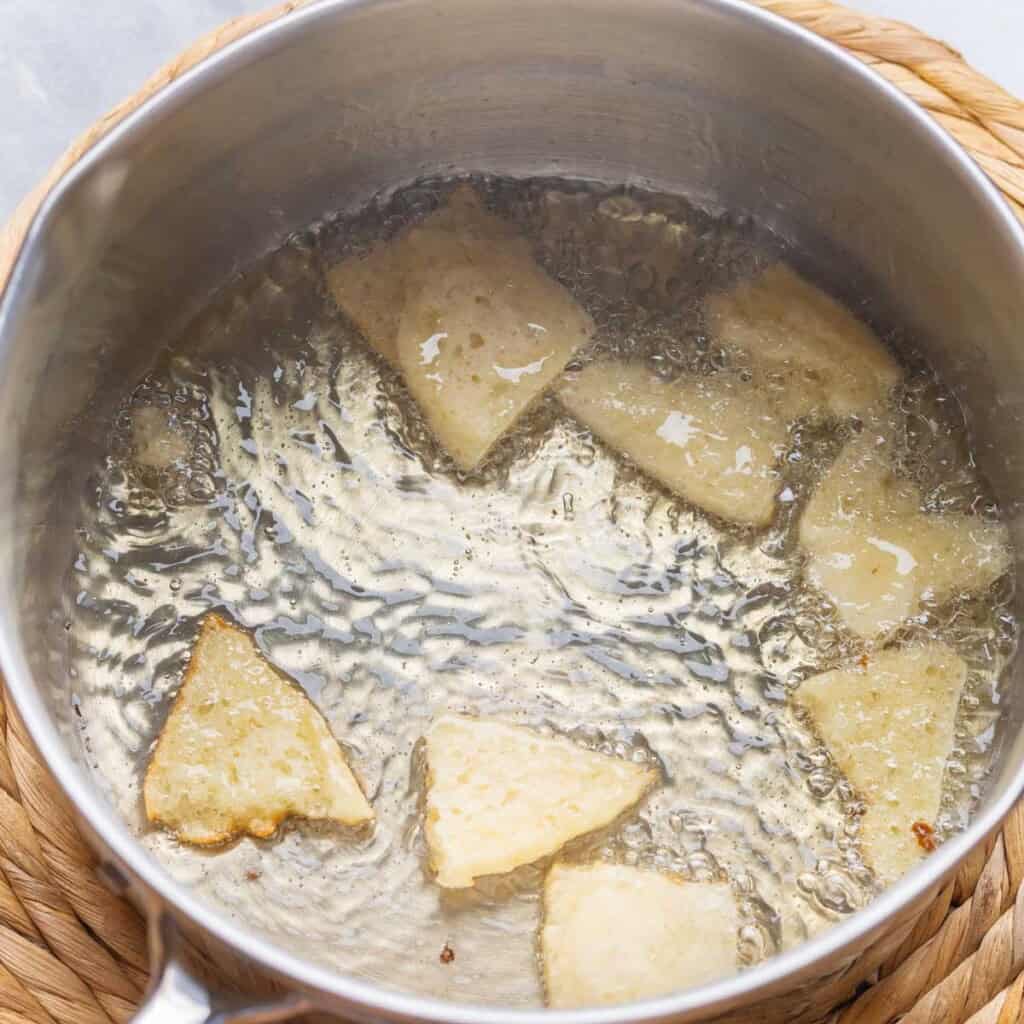 gluten free pita shallow frying in avocado oil in a medium sauce pan