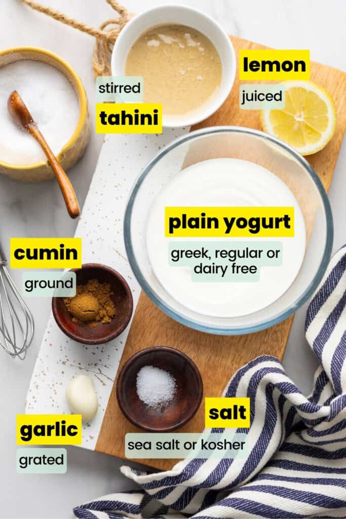 tahini yogurt sauce ingredients labeled: tahini yogurt sauce ingredients labeled: plain yogurt, tahini, cumin, garlic, lemon, salt