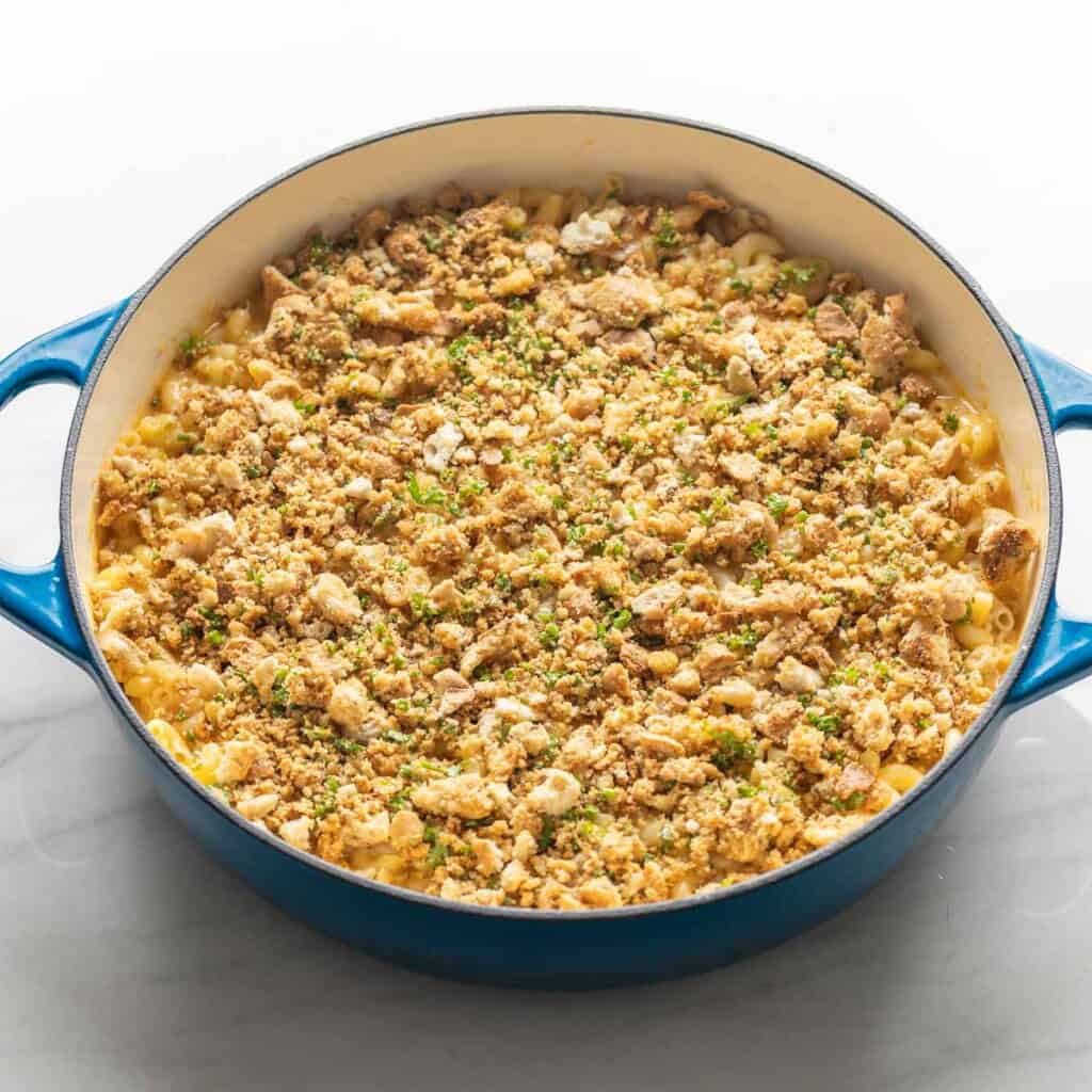 gluten free macaroni topped with seasoned bread crumbs in a casserole dish