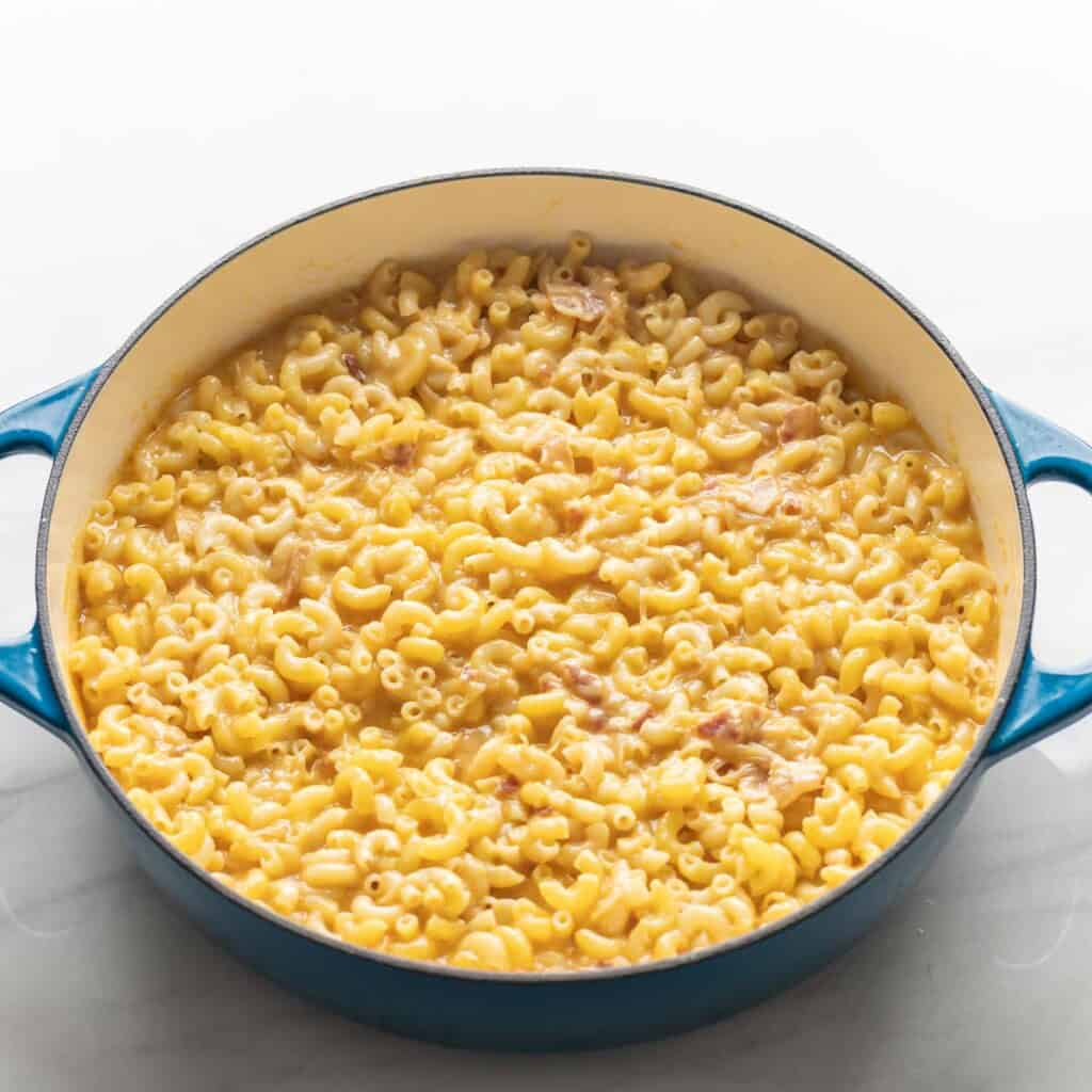 cooked gluten free macaroni mixed into a caramelized onion, bacon & cider cheese sauce