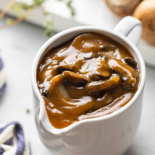 A gravy jug full of mushroom gravy
