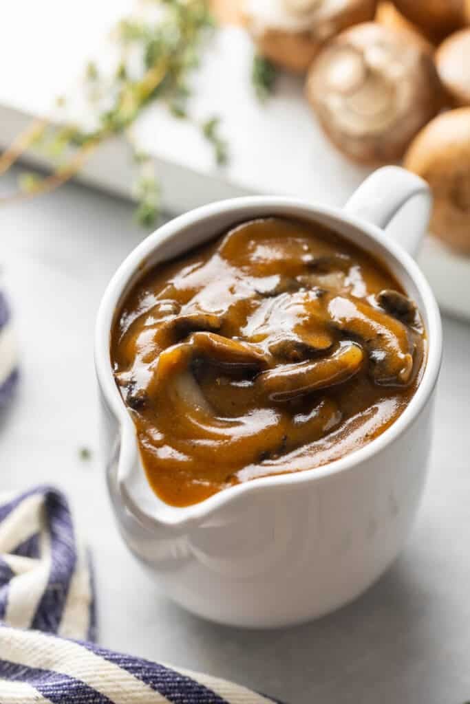 A gravy jug full of mushroom gravy
