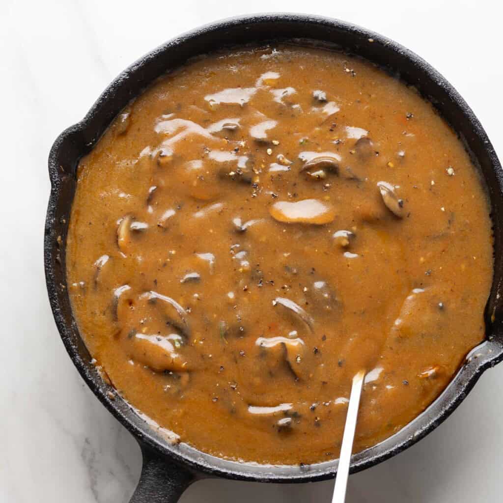 mushroom gravy in a cast iron pan