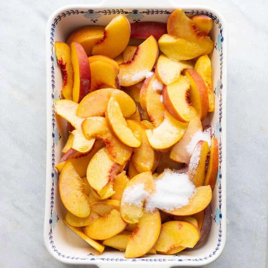 sliced peaches, sugar, vanilla, salt and lemon juice in an 11x7-inch baking dish
